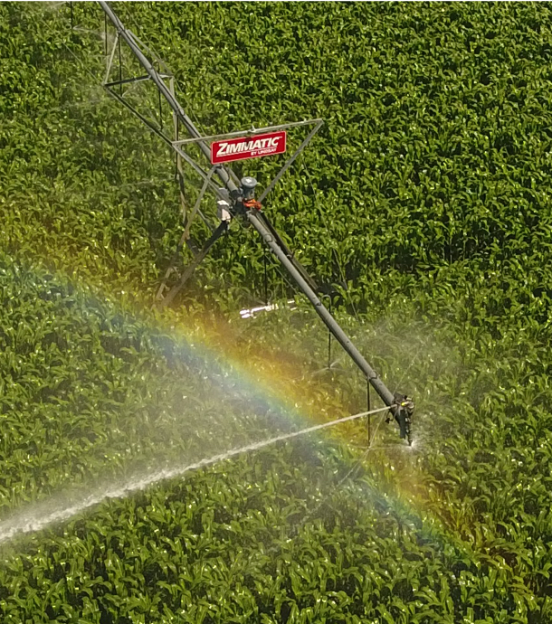 watering equipment spraying a farm's field